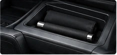 Collapsed baton inside a car center console