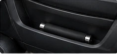 Collapsed baton in a vehicle door pocket