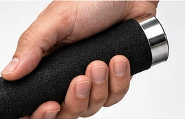 Close-up of hand holding black foam grip
