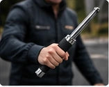 Person holding a telescopic baton