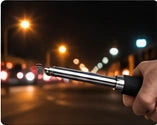 Nighttime roadside scene with a baton in the foreground